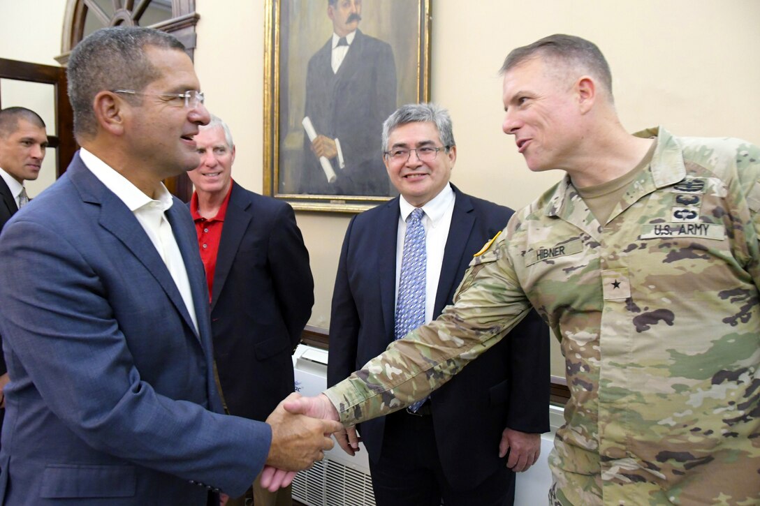 Puerto Rico Governor, Pedro Pierluisi talks with U. S. Army Corps of Engineers South Atlantic Division Commanding General, Brig. General  Daniel Hibner and Jaime A. Pinkham, The Assistant Secretary of the Army Civil Works during a visit and discussion of ongoing Corps projects in Puerto Rico on Dec. 8, 2022 in San Juan. (USACE photos by Mark Rankin)