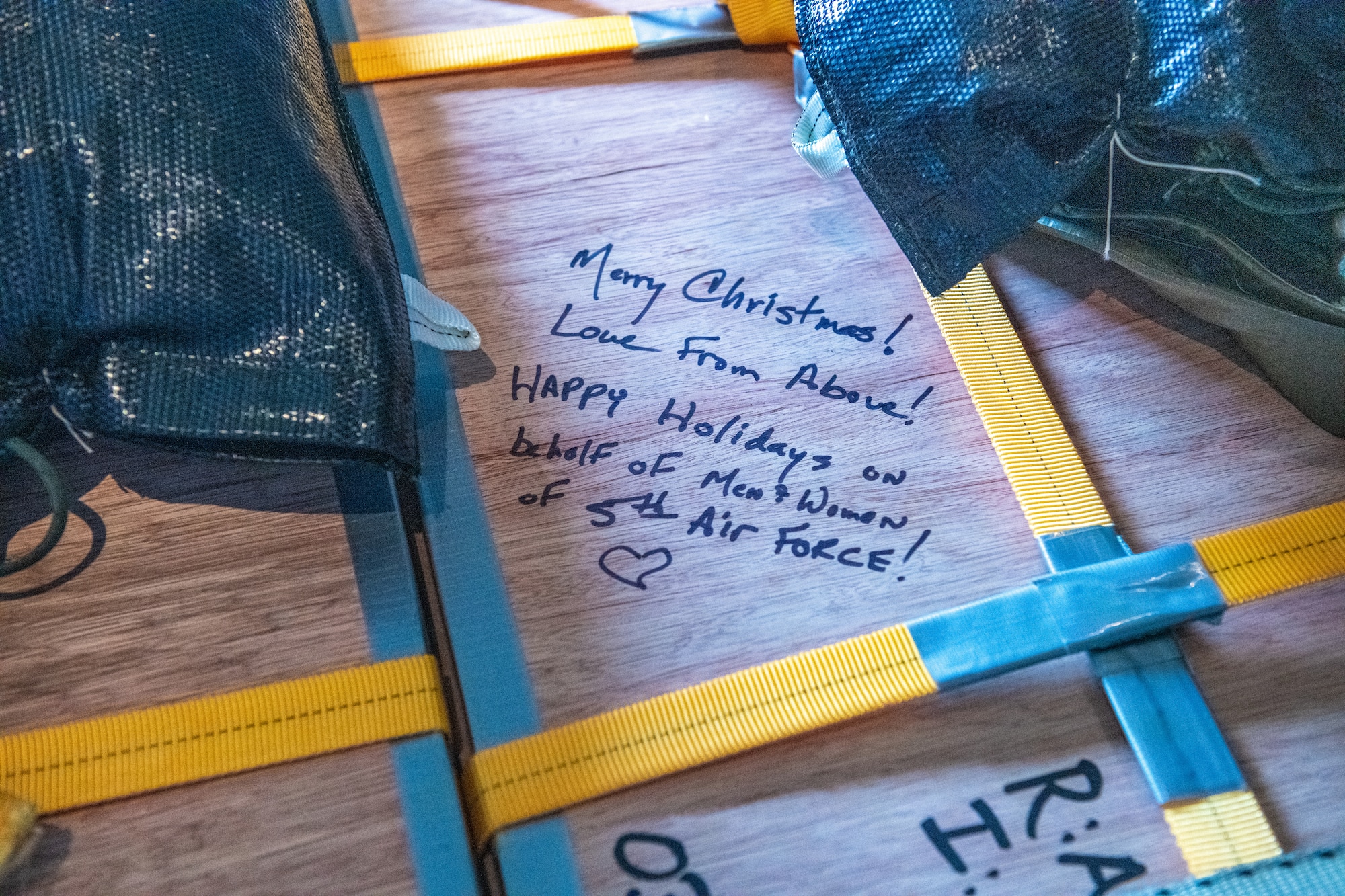 A written holiday message on a bundle aboard