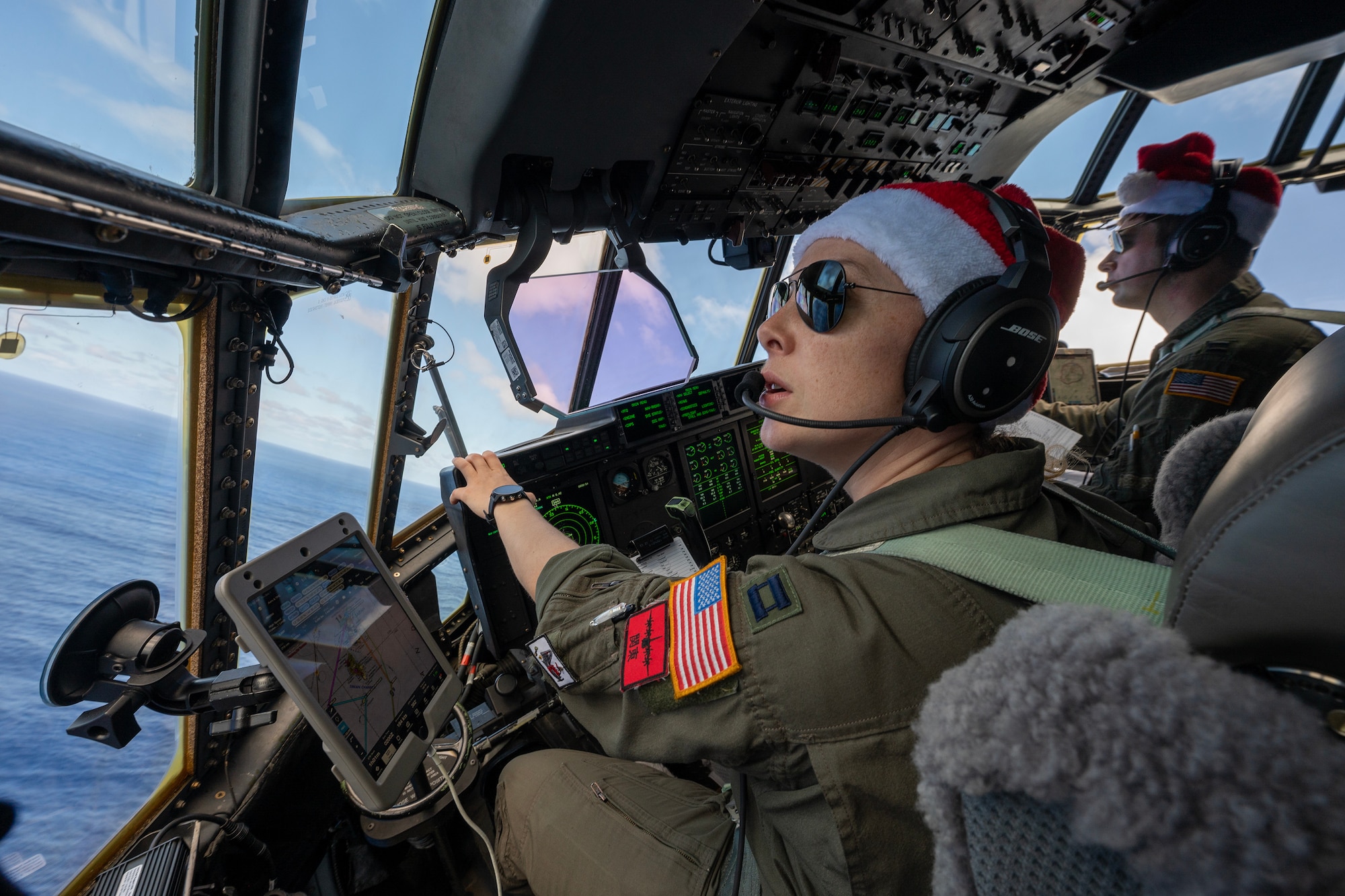 Pilots fly a C-130