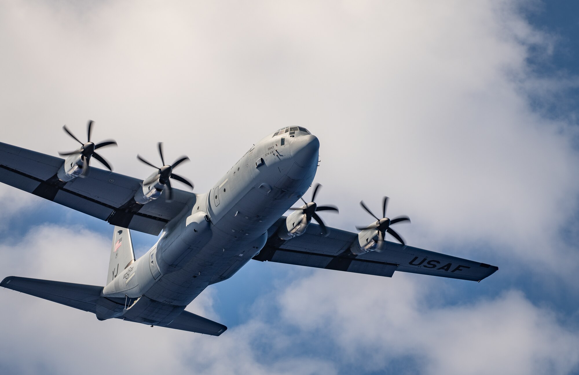 C-130 flies over a drop zone