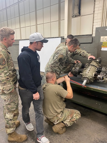 people look at an engine