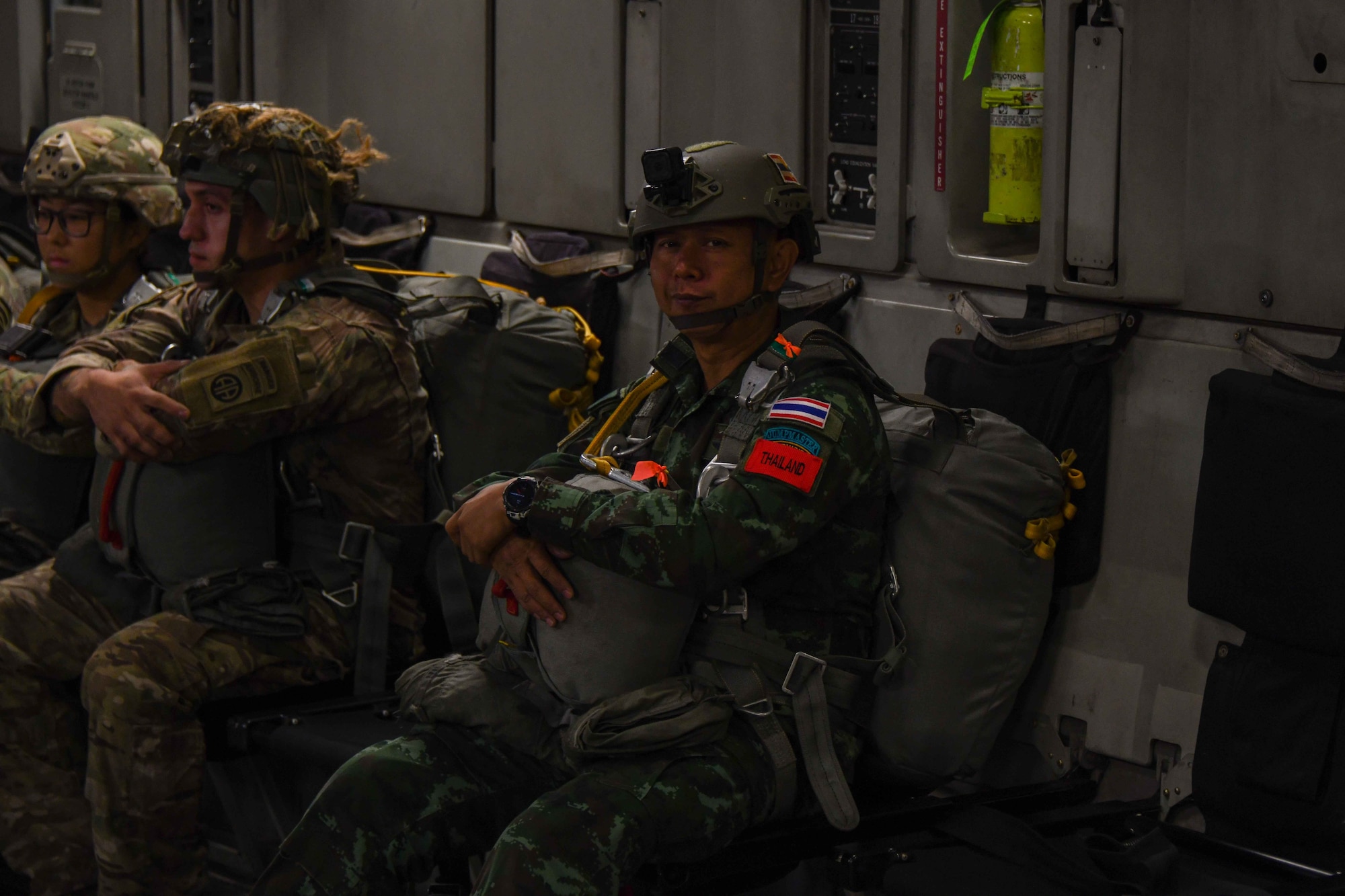 A soldier from the Royal Thai Army waits to jump out of a C-17 Globemaster III over the Sicily Drop Zone near Fayetteville, North Carolina, Dec. 8, 2022. This training gave U.S. military members an opportunity to learn alongside multiple partner nations. (U.S. Air Force photo by Airman 1st Class Kari Degraffenreed)