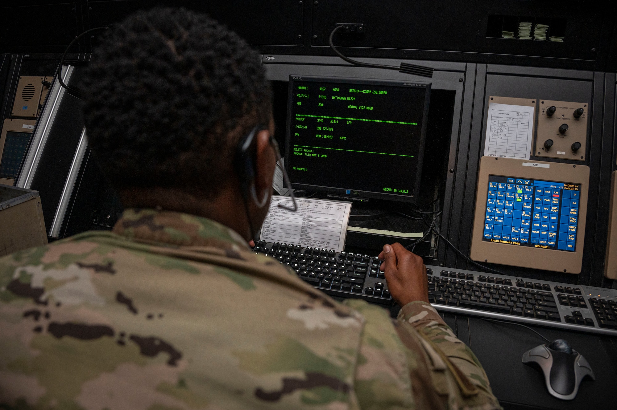 Master Sgt. Marquis Jones, 4th Operations Support Squadron air traffic control watch supervisor, communicates with aircrew during a simulated scenario at Seymour Johnson Air Force Base, North Carolina, Dec. 13, 2022. The 4th OSS Radar Approach Control Airmen can monitor or communicate with over 30 aircraft at a time, and provide critical flight information to aircraft flying in and around the base. (U.S. Air Force photo by Airman 1st Class Sabrina Fuller)