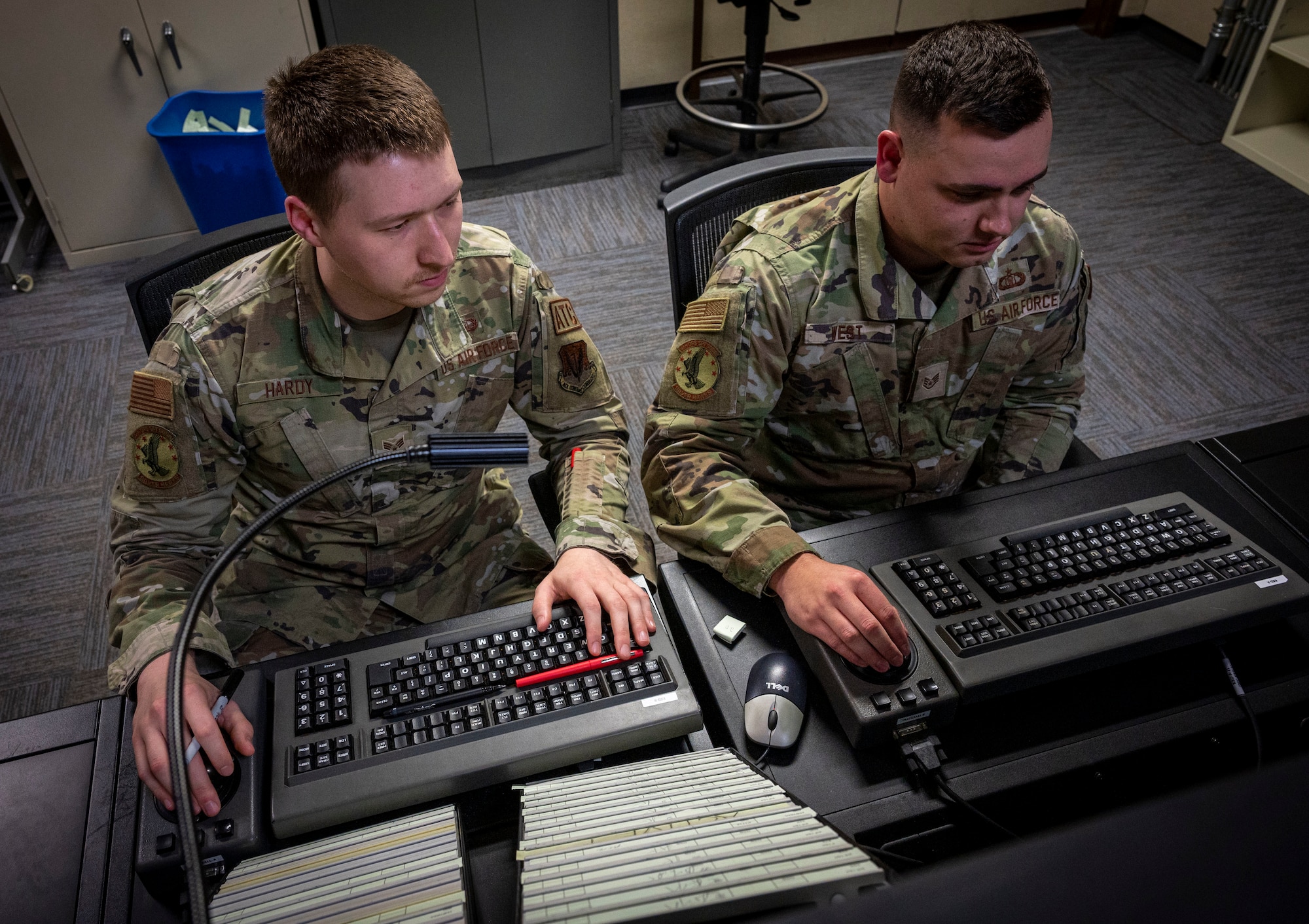 Staff Sgt. Tyler West (right), 4th Operations Support Squadron air traffic control watch supervisor, and Senior Airman Daniel Hardy, 4th OSS air traffic control specialist, work on a simulated scenario at Seymour Johnson Air Force Base, North Carolina, Dec. 13, 2022. The 4th OSS Radar Approach Control has a primary radar that goes out 60 nautical miles, and a secondary radar that reaches out 120 nautical miles that provides long-distance communication. (U.S. Air Force photo by Airman 1st Class Sabrina Fuller)