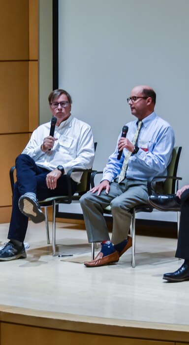Case Western Reserve University Nutrition Professor and BioSIS founder Dr. Mark Chance, left, discusses advancements in wearable biomolecular sensor technology with Air Force Research Laboratory, or AFRL, Senior Materials Engineer and Technical Lead Dr. Lawrence Drummy, right, Aug. 18, 2022, during the Biomedical Sciences for the Department of Defense Mission Symposium at Case Western Reserve University in Cleveland, Ohio. AFRL partnered with the Nano Bio-Materials Consortium and Case Western Reserve University to create wearable biomolecular sensors that measure biomarkers in Airmen and Guardians, and has transferred that technology to Sensate Biosystems, a spinoff company of Case Western Reserve University. (Courtesy photo)