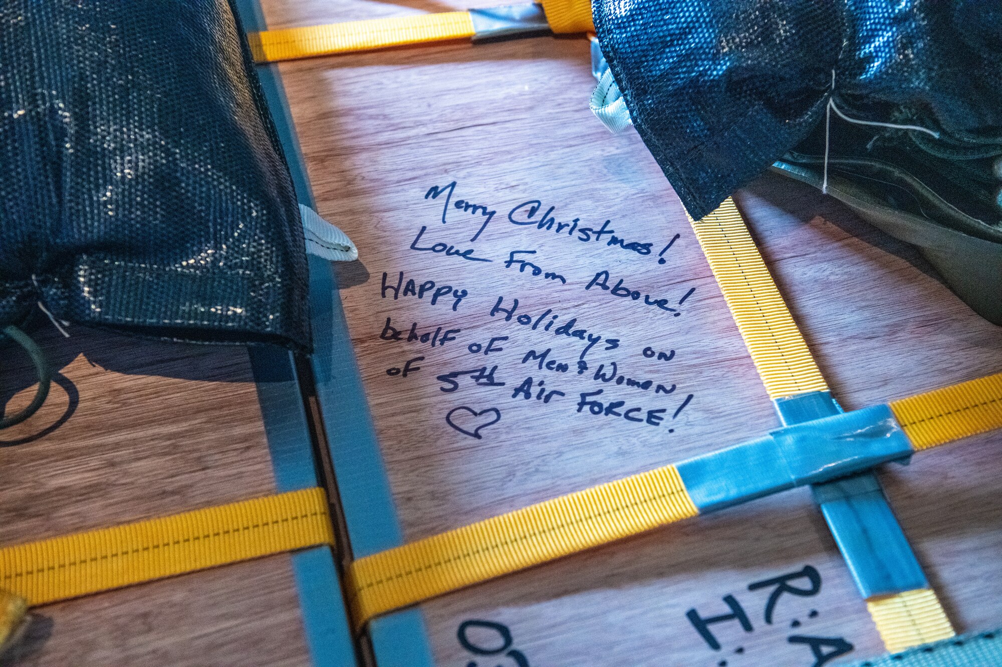 A written holiday message on a bundle aboard