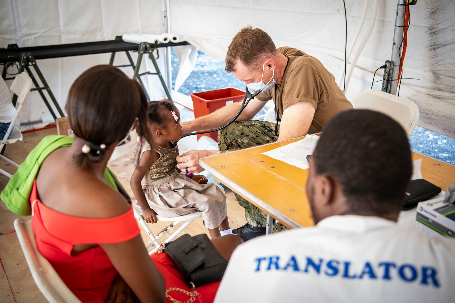 Cmdr. Michael Cunningham, a pediatric cardiologist, from Chesapeake, Virginia, provides medical care during Continuing Promise 2022 at a medical site in Jeremie, Haiti, Dec. 12, 2022. Comfort is deployed to U.S. 4th Fleet in support of CP22, a humanitarian assistance and goodwill mission conducting direct medical care, expeditionary veterinary care, and subject matter expert exchanges with five partner nations in the Caribbean, Central and South America.