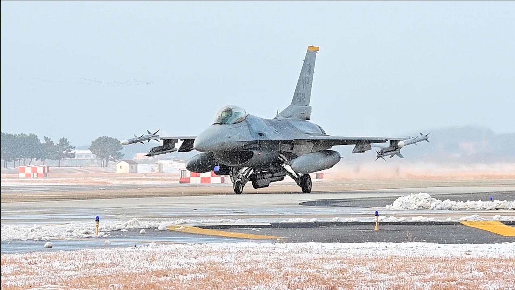 An 8th Operations Group F-16 Fighting Falcon taxis at Kunsan Air Base, Republic of Korea, Dec. 14, 2022. The Wolf Pack operates around the year and practices taking off in various weather conditions. (U.S. Air Force photo by Staff Sgt. Isaiah J. Soliz)