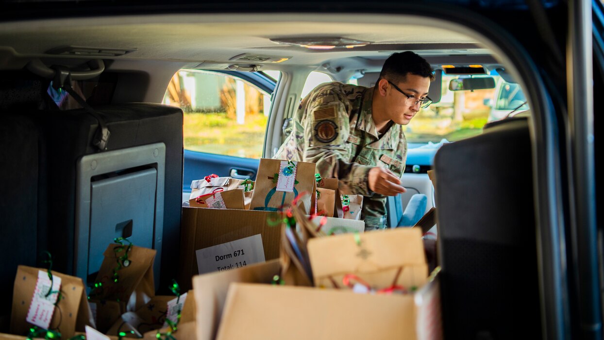 U.S. Air Force Airmen package cookies for delivery during the annual Cookie Caper event at Misawa Air Base, Japan, Dec. 13, 2022. After the cookies were divided and packaged, first sergeants and other volunteers across the base hand-delivered them to their units.