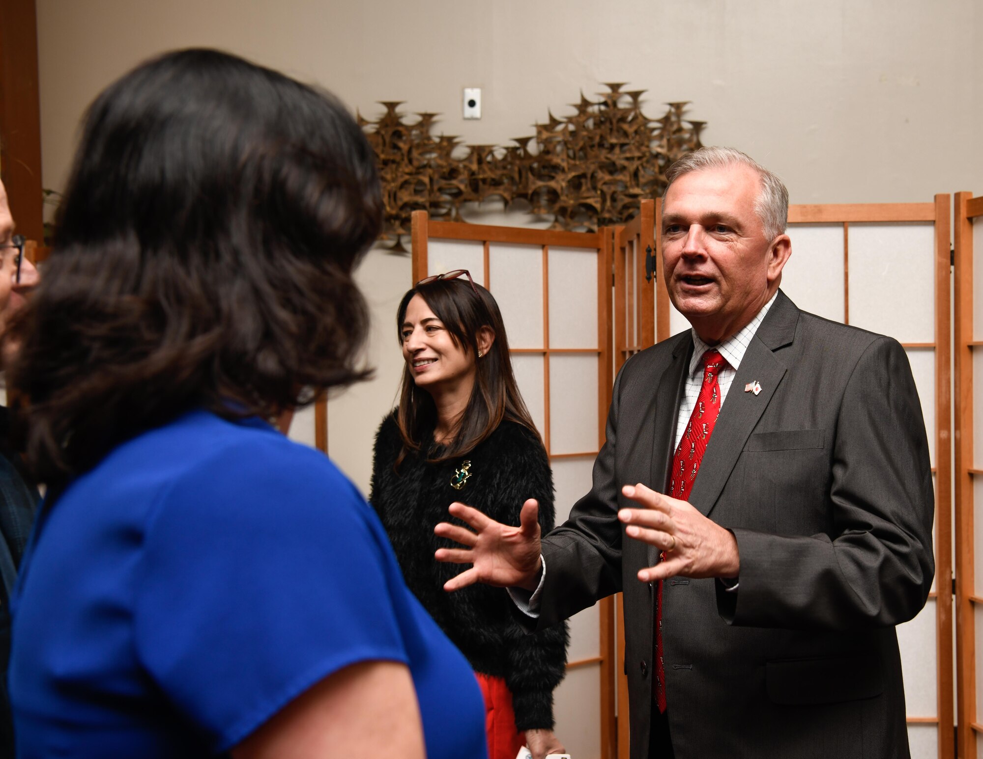 Lt. General Ricky Rupp speaks with attendee.