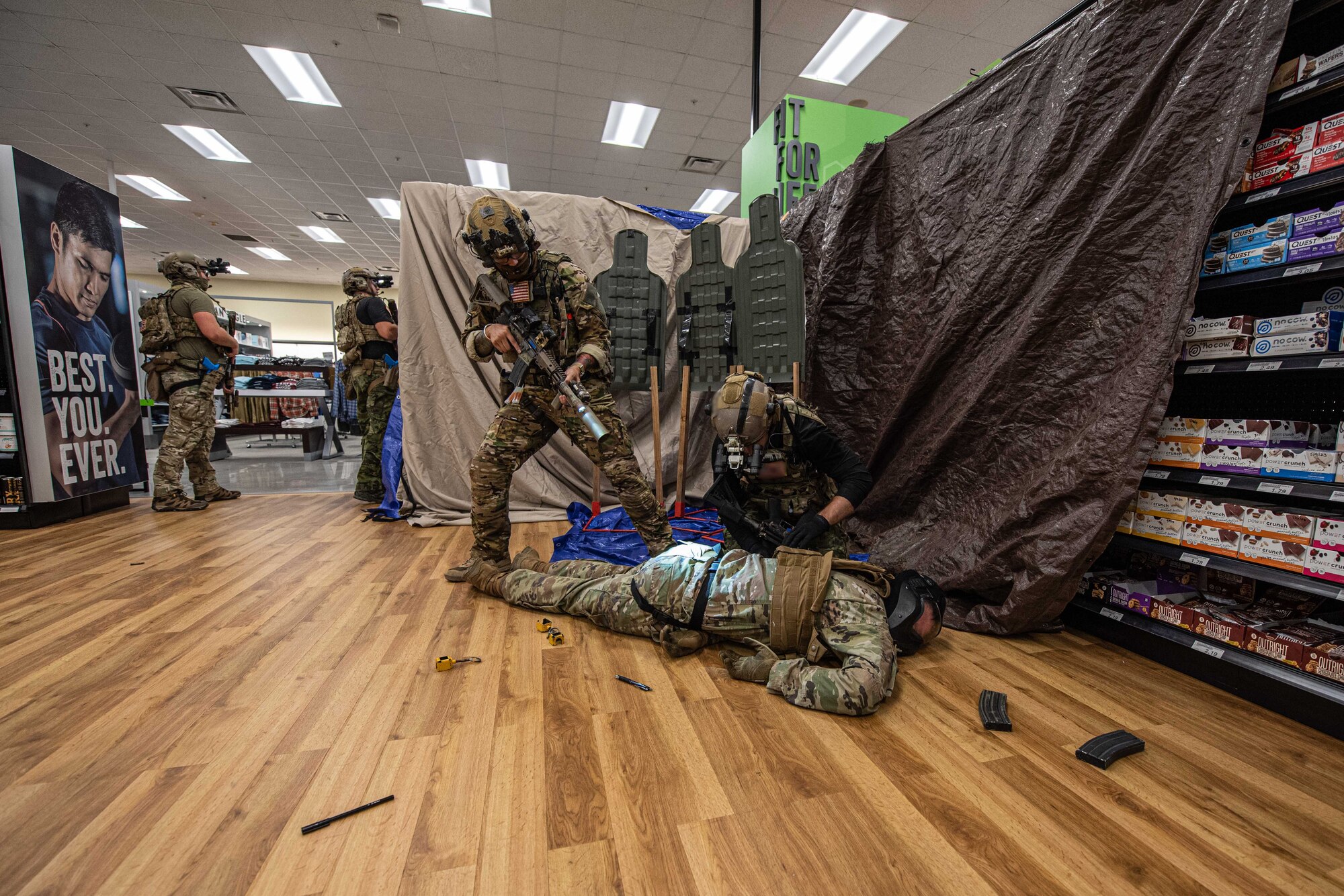 Soldiers apprehend a simulated shooter.