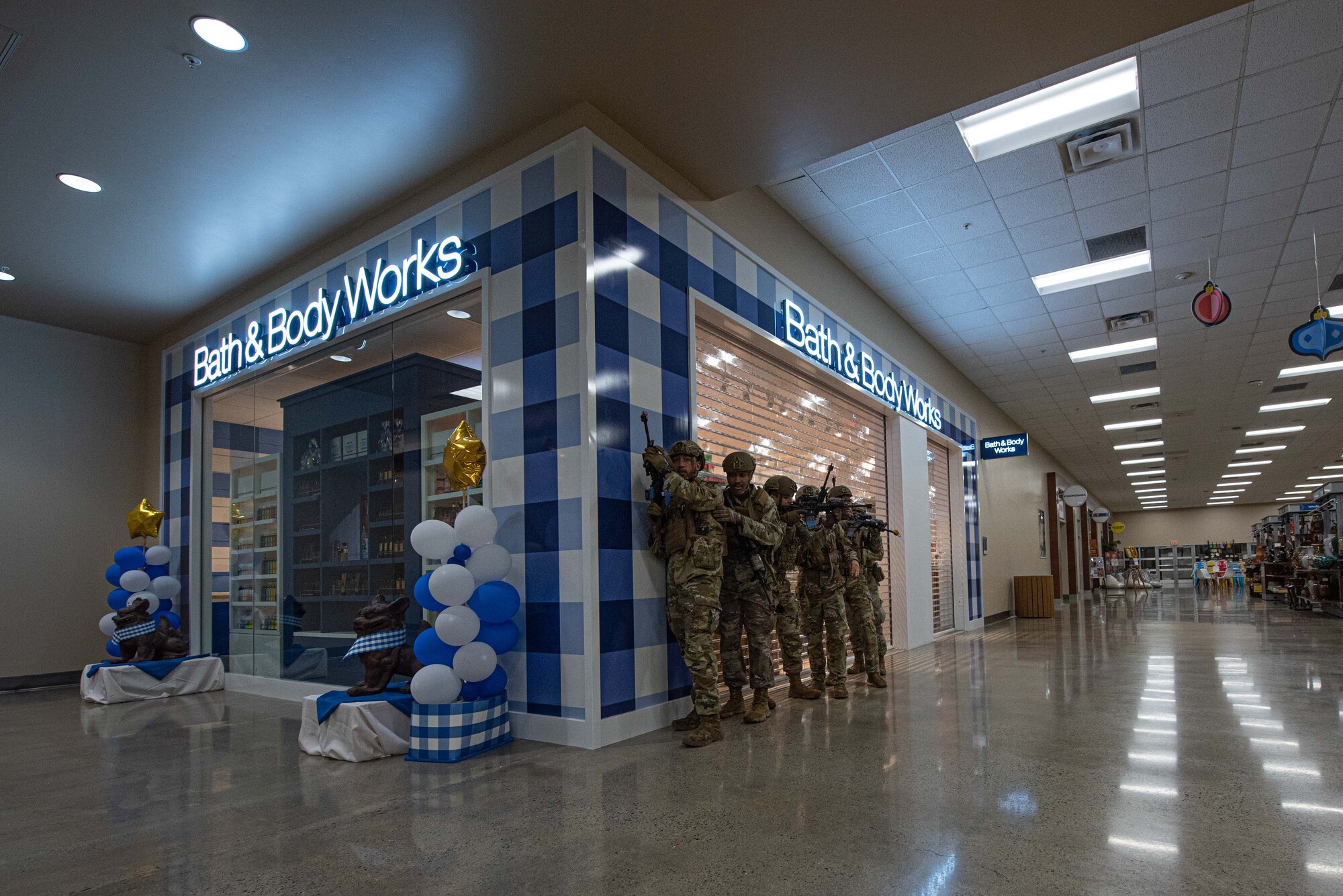 Airmen clear a building.