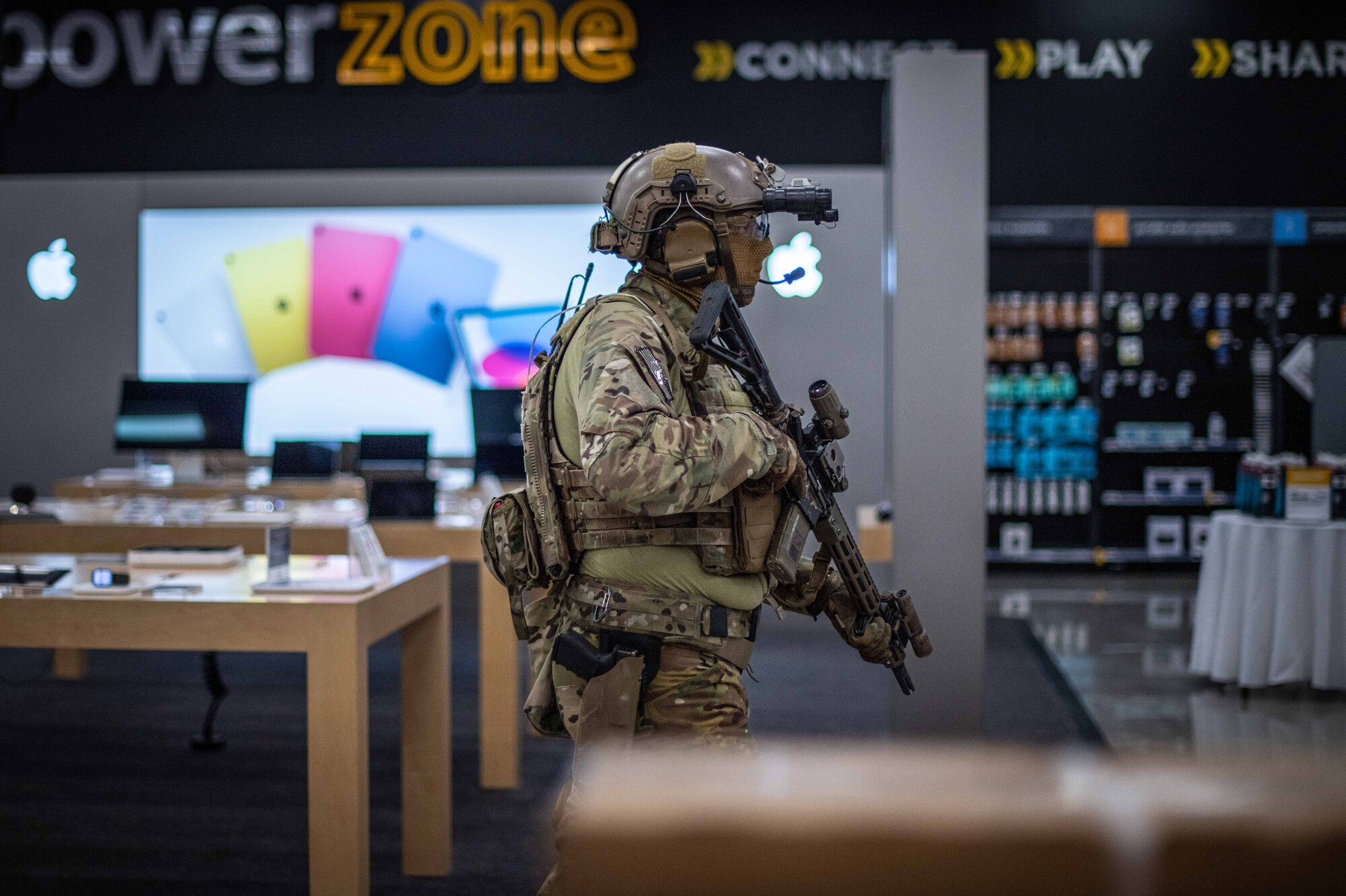 A Soldier checks an aisle.