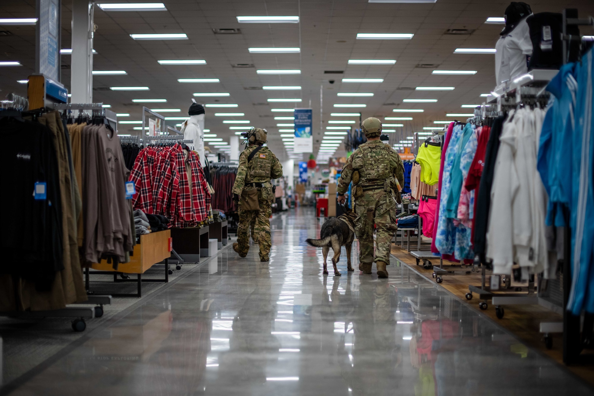 A Soldier and an Airman check an aisle.