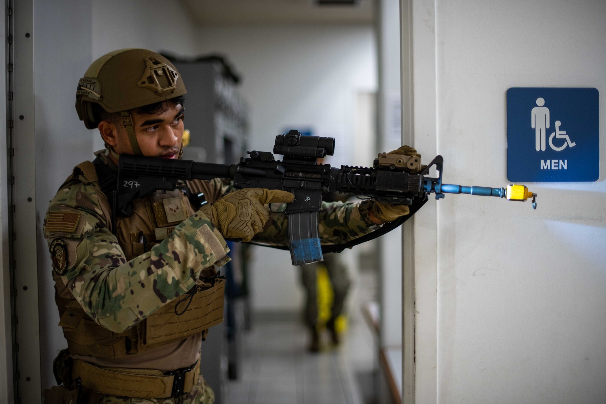 An Airman checks a room.