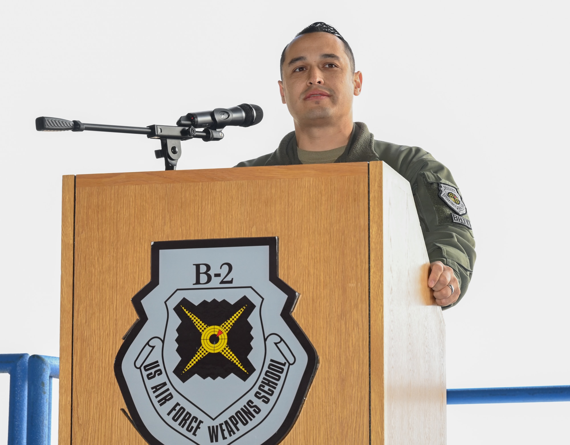 Lt. Col. Marcus Antonini, previous 325th Weapons Squadron, 57th Wing, speaks during a change of command at Whiteman Air Force Base, Missouri, December 14, 2022. Change of commands are a tradition dating back hundreds of years, with the U.S. Air Force adopting it from the U.S. Army. (U.S. Air Force photo by Airman 1st Class Joseph Garcia)