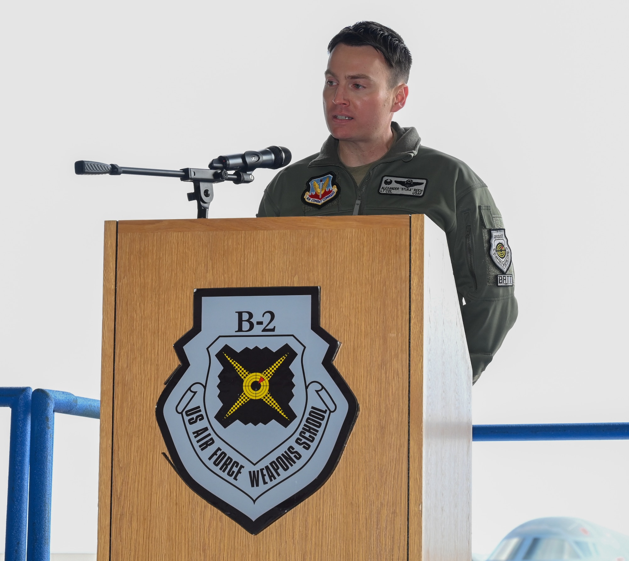 Lt. Col. Alexander Reich, 325th Weapons Squadron, 57th Wing, speaks during a change of command at Whiteman Air Force Base, Missouri, December 14, 2022. Change of commands are a tradition dating back hundreds of years, with the U.S. Air Force adopting it from the U.S. Army. (U.S. Air Force photo by Airman 1st Class Joseph Garcia)