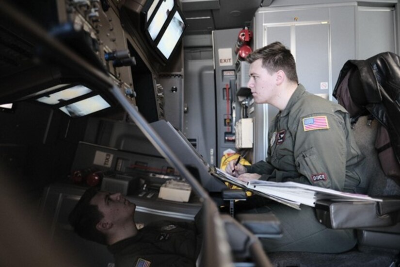 Man looks at boom operation screen on jet