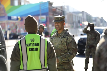 The Adjutant General of the District of Columbia National Guard, Aaron R. Dean II, and Senior Enlisted Leader, Ronald L. Smith, visit fellow Capital Guardians at traffic control points near the Africa Leaders Summit.