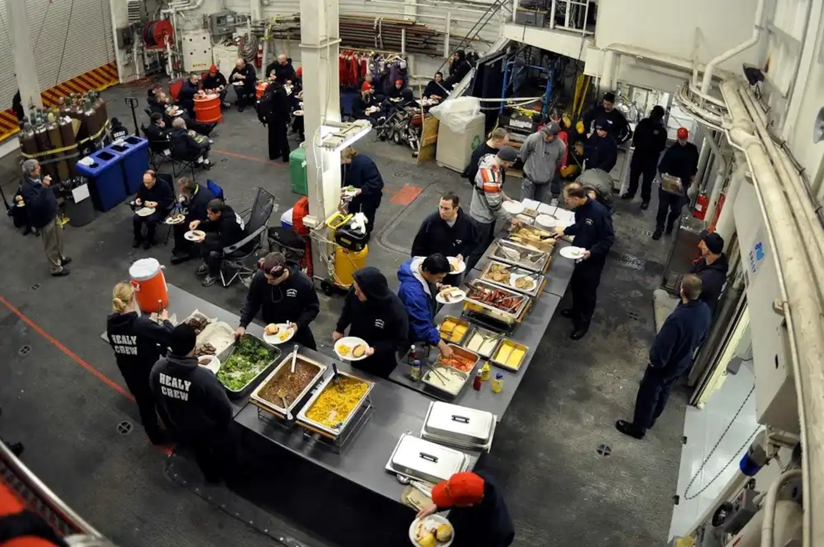 The crew and science team aboard the Coast Guard Cutter Healy conclude a morale day with a cook out in the hangar Sept. 2, 2009.

(U.S. Coast Guard photo by Petty Officer Patrick Kelley)