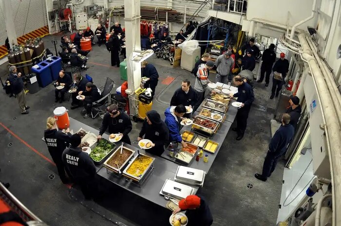 The crew and science team aboard the Coast Guard Cutter Healy conclude a morale day with a cook out in the hangar Sept. 2, 2009.

(U.S. Coast Guard photo by Petty Officer Patrick Kelley)