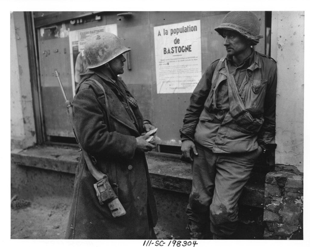 (L-R) Pvt. Adam H. Davis and Tech Sgt. Milford A. Sillars, infantrymen with the 28th Infantry Division’s 110th Infantry Regiment, in Bastogne, Belgium, on Dec. 19, 1944, following the German breakthrough in that area. (U.S. Army Signal Corps photo)