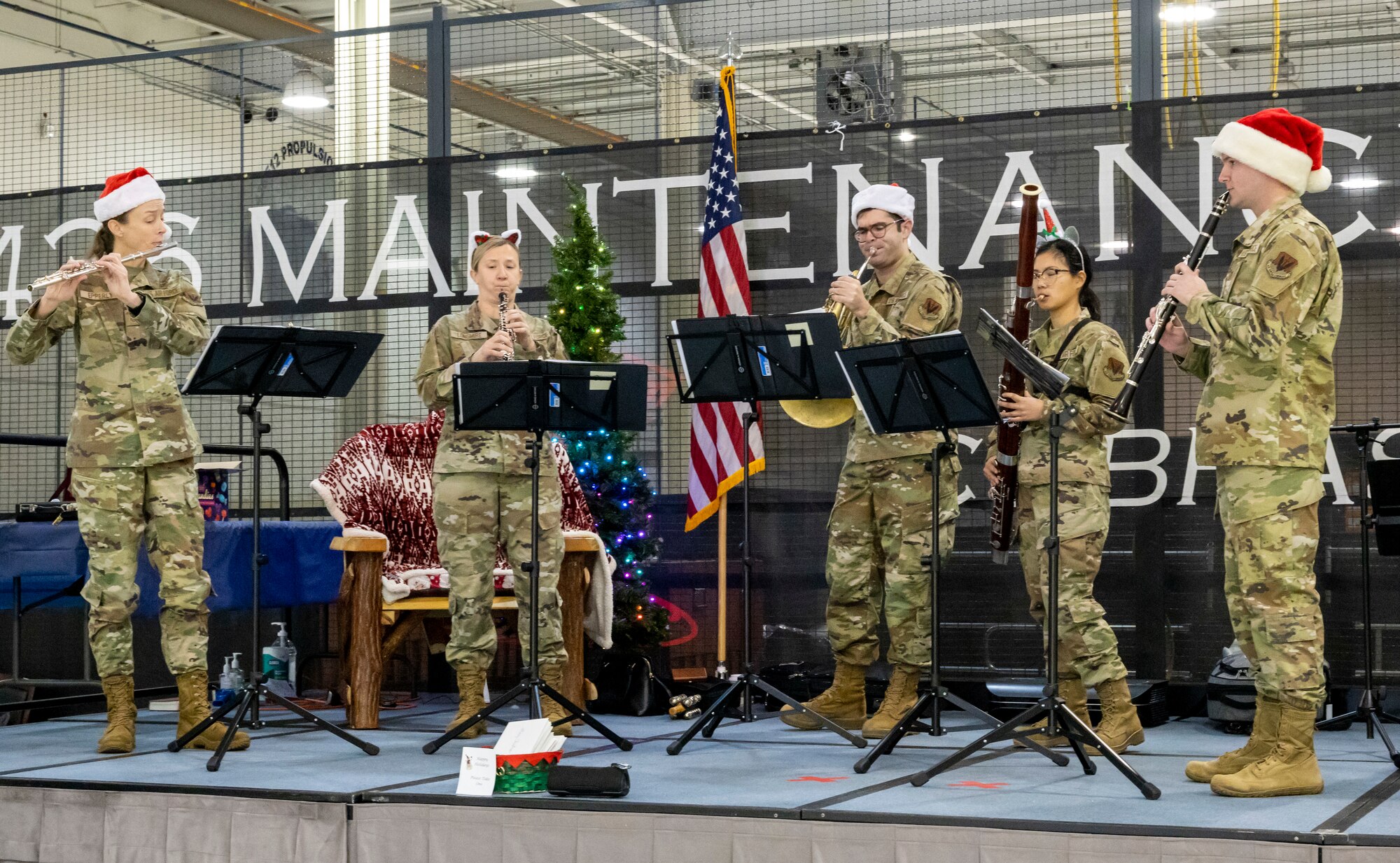 Members of the U.S. Air Force Heritage of America Band perform during Operation Feed the Troops on Dover Air Force Base, Delaware, Dec. 14, 2022. The band played a variety of holiday songs while Team Dover members enjoyed a holiday meal. (U.S. Air Force photo by Senior Airman Stephani Barge)