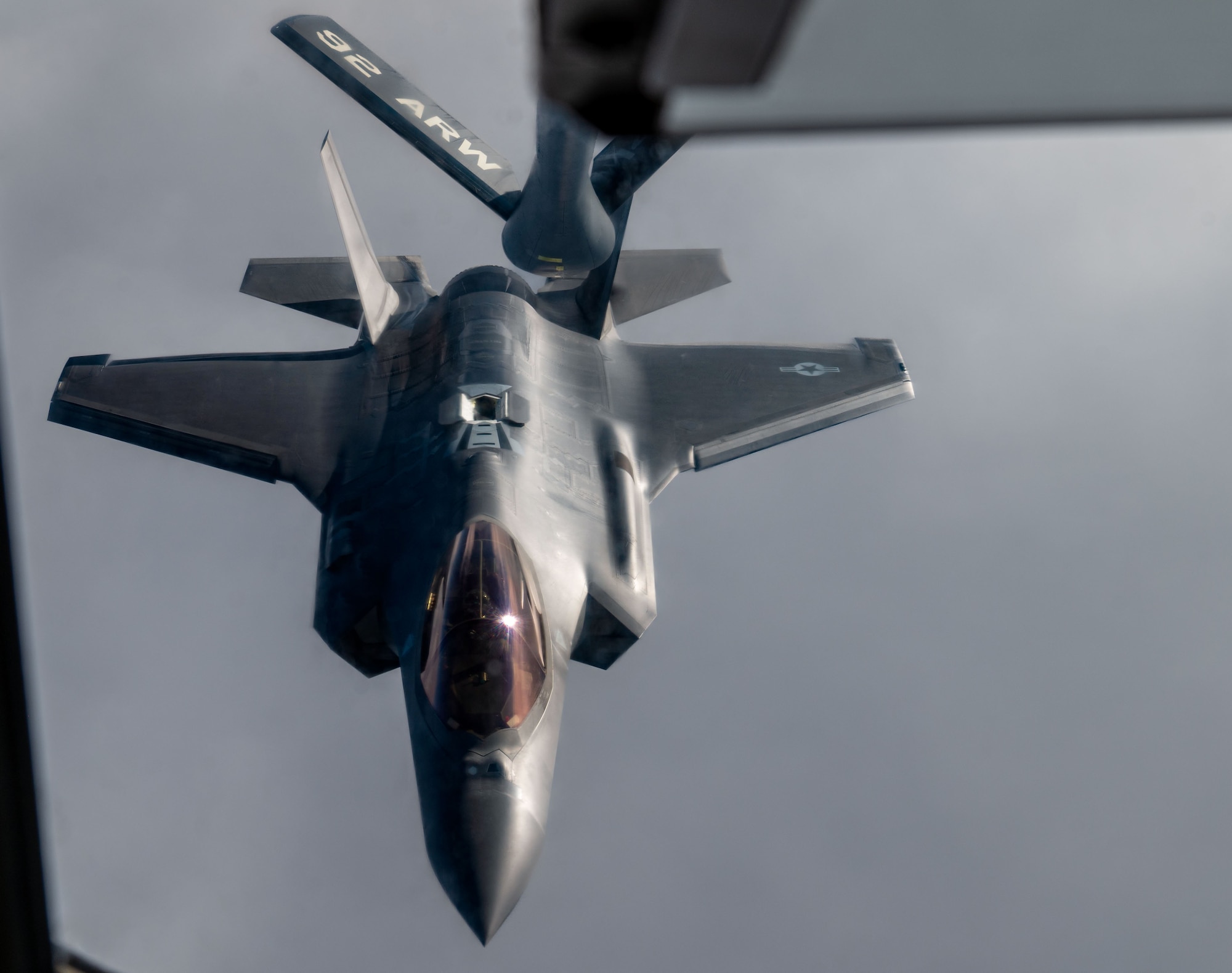 A U.S. Air Force F-35 Lighting II from Hill Air Force Base prepares to receive fuel from a KC-135 Stratotanker from Fairchild Air Force Base, Dec. 12, 2022. Crew members from Fairchild conducted an air refueling mission to enhance mission readiness for both the KC-135 and F-35 crews. (U.S. Air Force photo by Airman 1st Class Stassney Davis)