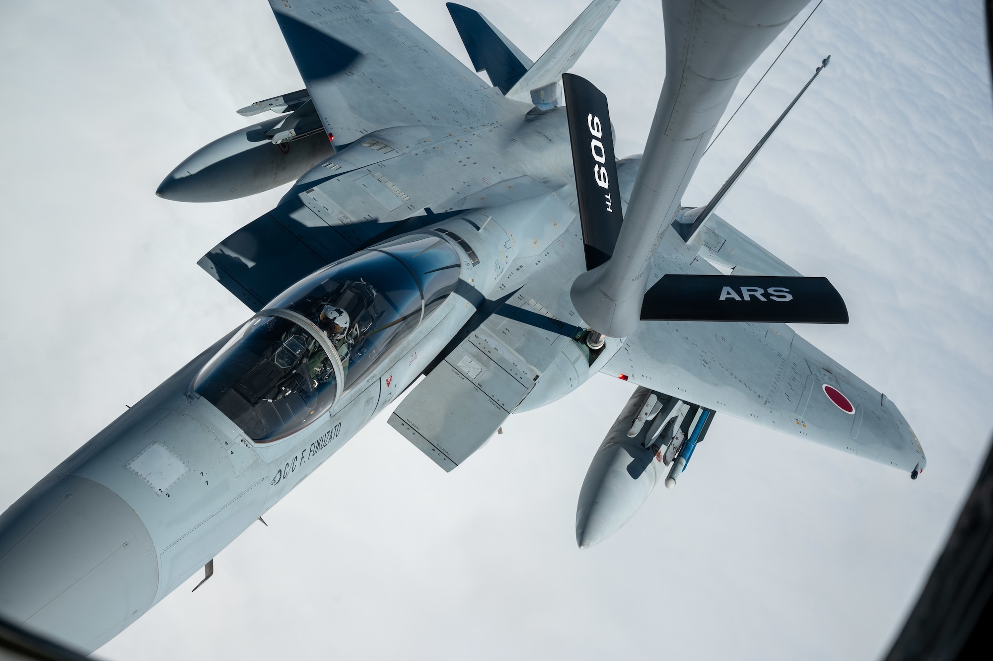 A Japan Air Self-Defense Force F-15J Eagle receives fuel from a U.S. Air Force KC-135 Stratotanker