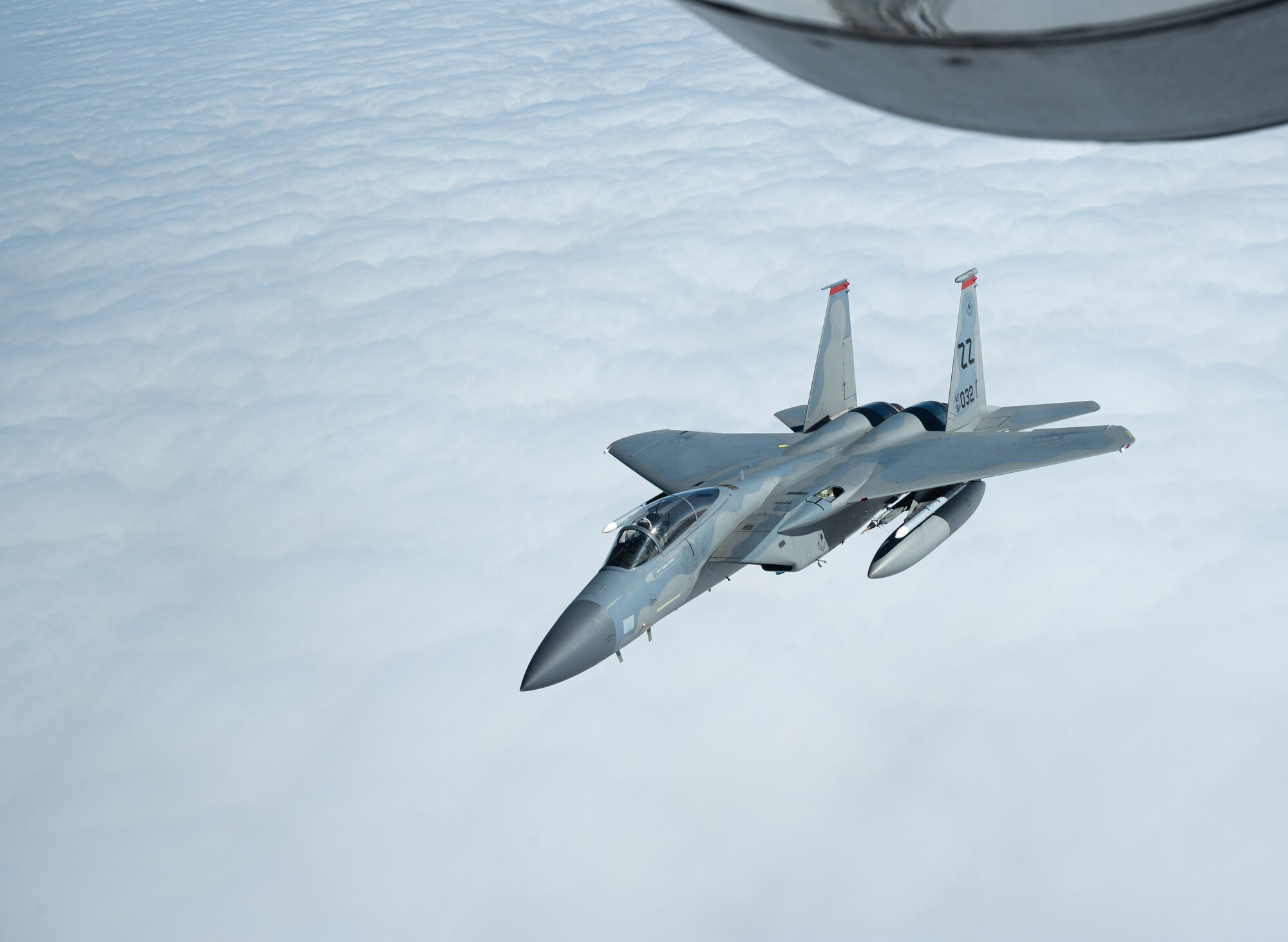 A USAF aircraft flies away after receiving fuel form another aircraft