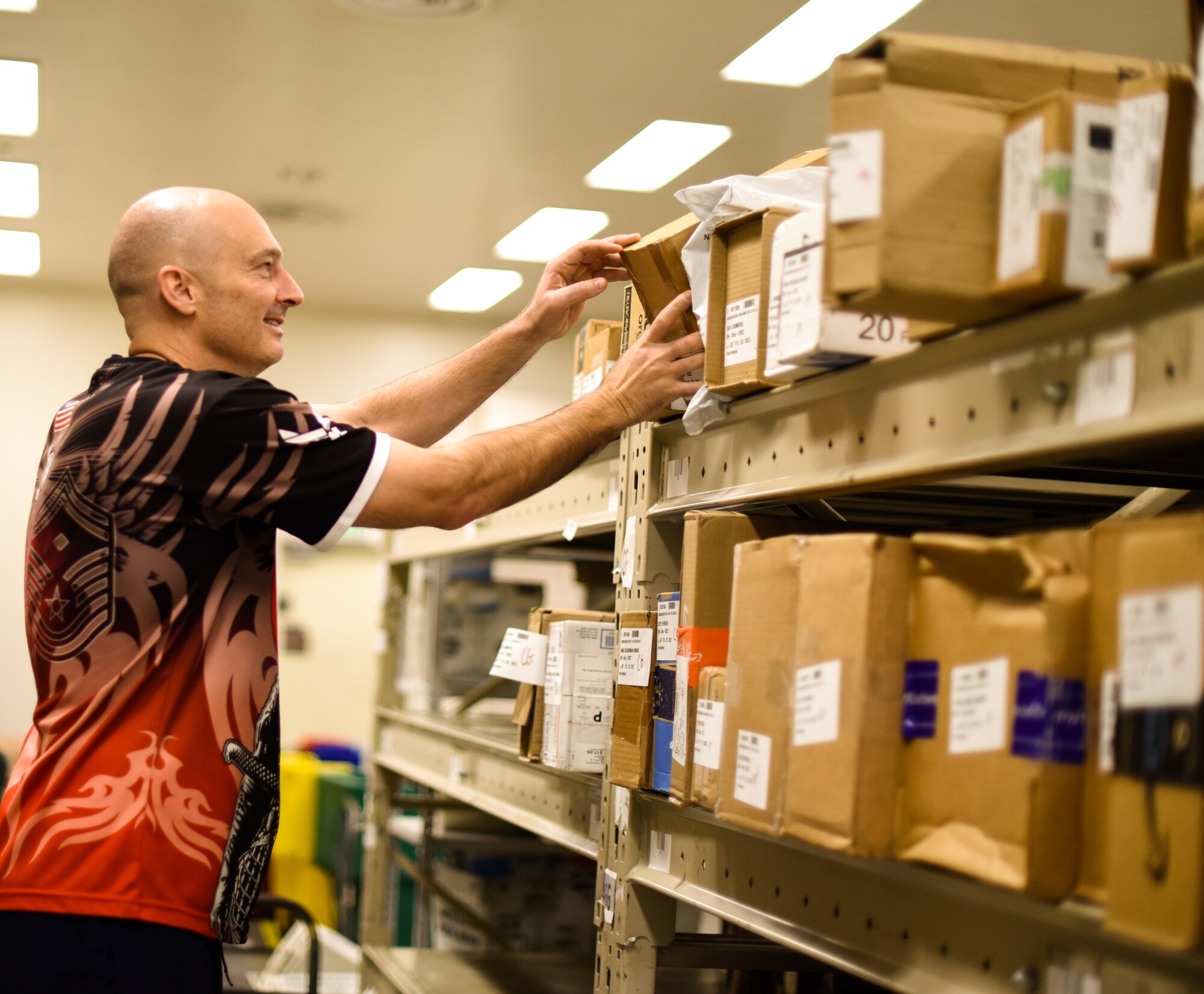 1st Sgt finds a package on the top shelf and is removing it.