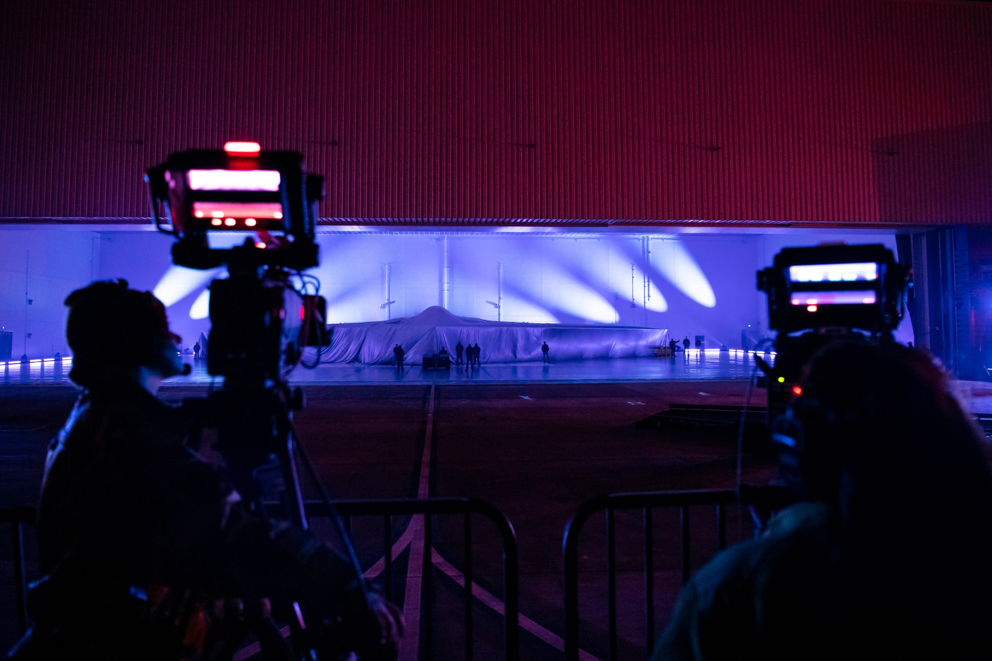 A covered Northrop Grumman B-21 Raider is displayed during a practice unveiling ceremony at Northrop Grumman’s manufacturing facility on Air Force Plant 42 in Palmdale, California, Dec. 1, 2022.