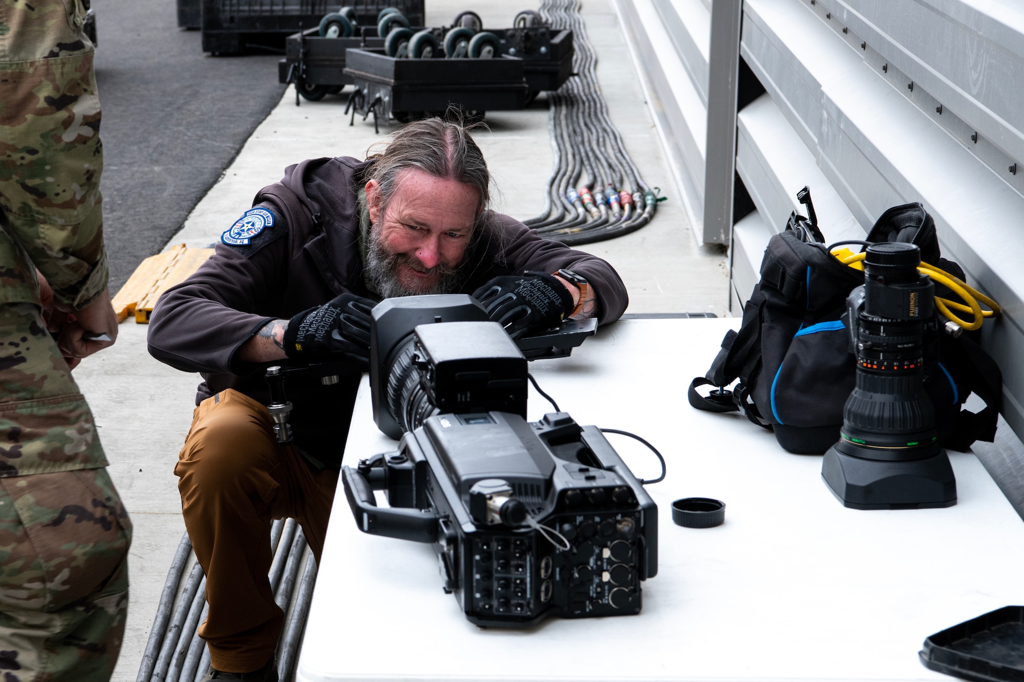 Mr. Adam White, 2d Audiovisual Squadron, producer/director checks a camera at Northrop Grumman’s manufacturing facility on Air Force Plant 42 in Palmdale, California, Dec. 1, 2022