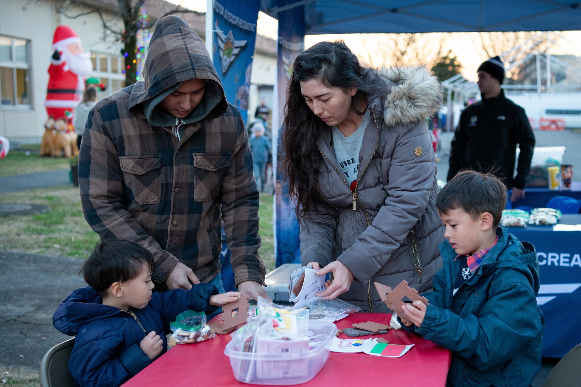 A family makes holiday themed crafts