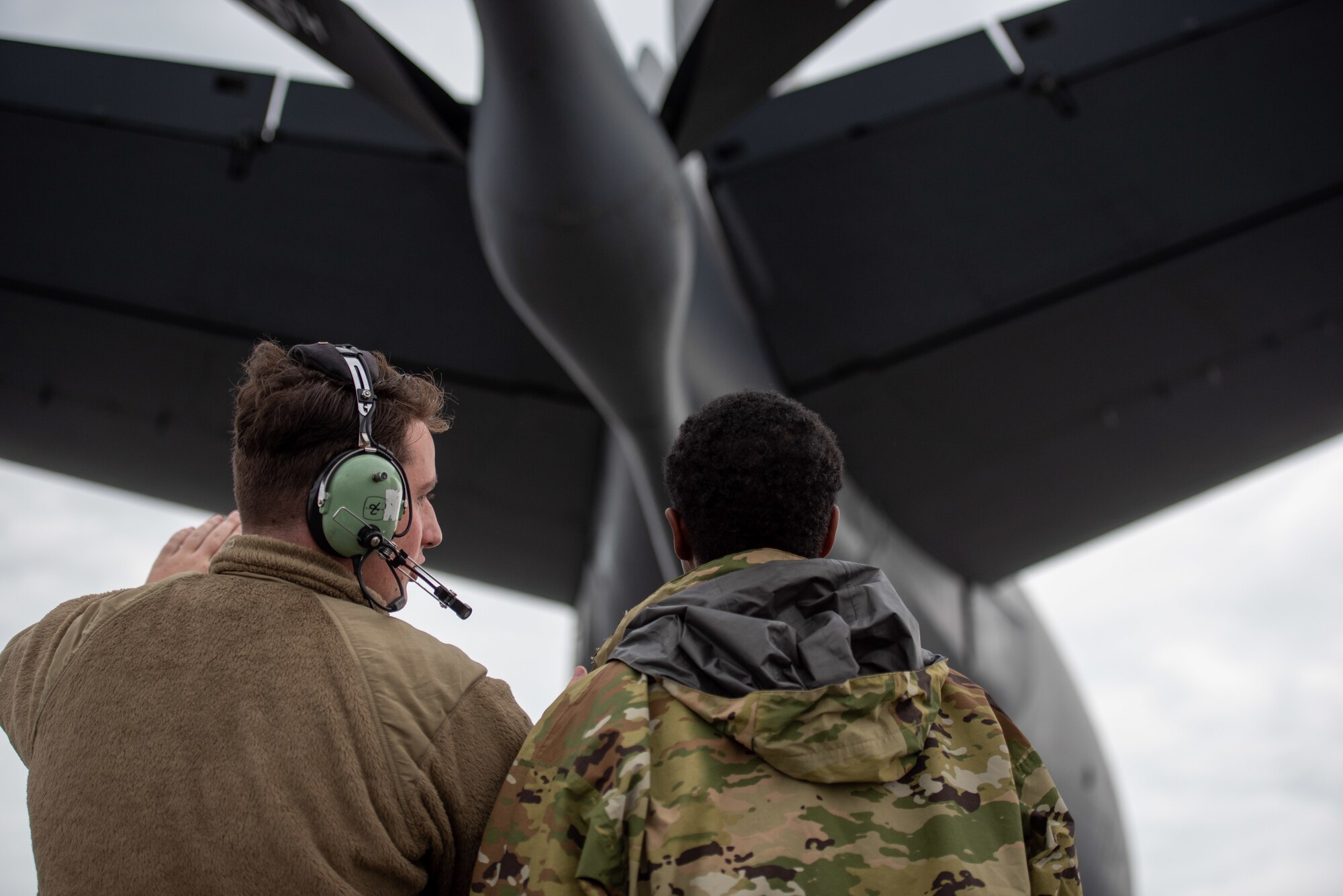 Maintainers inspecting aircraft