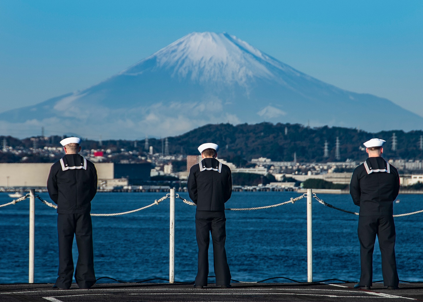 Sailors man the rails as the U.S. Navy’s only forward-deployed aircraft carrier, USS Ronald Reagan (CVN 76), returns to Commander, Fleet Activities Yokosuka, Japan, following its deployment to the western Pacific ocean, Dec. 16. During Ronald Reagan’s deployment, the ship conducted joint Carrier Strike Group (CSG) exercises with the Republic of Korea Navy, participated in multinational exercises with the Japan Maritime Self-Defense Force and Royal Australian Navy during Valiant Shield, Keen Sword and Malabar 2022 and visited the Philippines, Singapore, Korea and Guam. Ronald Reagan, the flagship of CSG 5, provides a combat-ready force that protects and defends the United States, and supports Alliances, partnerships and collective maritime interests in the Indo-Pacific region.