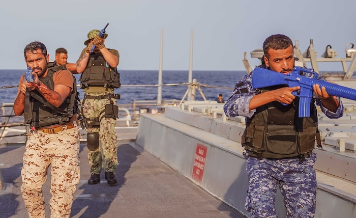 GULF OF OMAN (Dec. 8, 2022) A multinational boarding team, consisting of members from navies and coast guards for the United States and Middle Eastern nations including Bahrain, rehearses vessel boarding procedures aboard guided-missile destroyer USS The Sullivans (DDG 68) in the Gulf of Oman, Dec. 8. U.S. 5th Fleet conducted a two-week multinational vessel boarding integration event with regional partners to deepen maritime security cooperation.