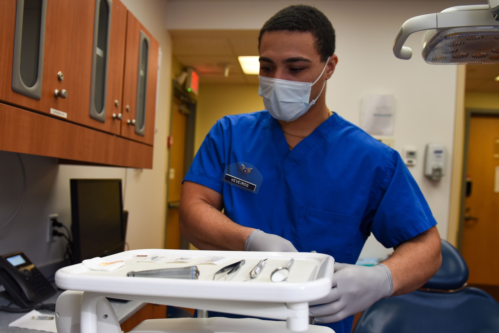Senior Airman Malik Veveiros, 8th Operational Medical Readiness Squadron dental technician, organizes dental tools before a procedure at Kunsan Air Base, Republic of Korea, Dec. 14, 2022. A dental technician often operates as a second set of hands and eyes while a dentist is completing their procedures. (U.S. Air Force Photo by Tech. Sgt. Timothy Dischinat)
