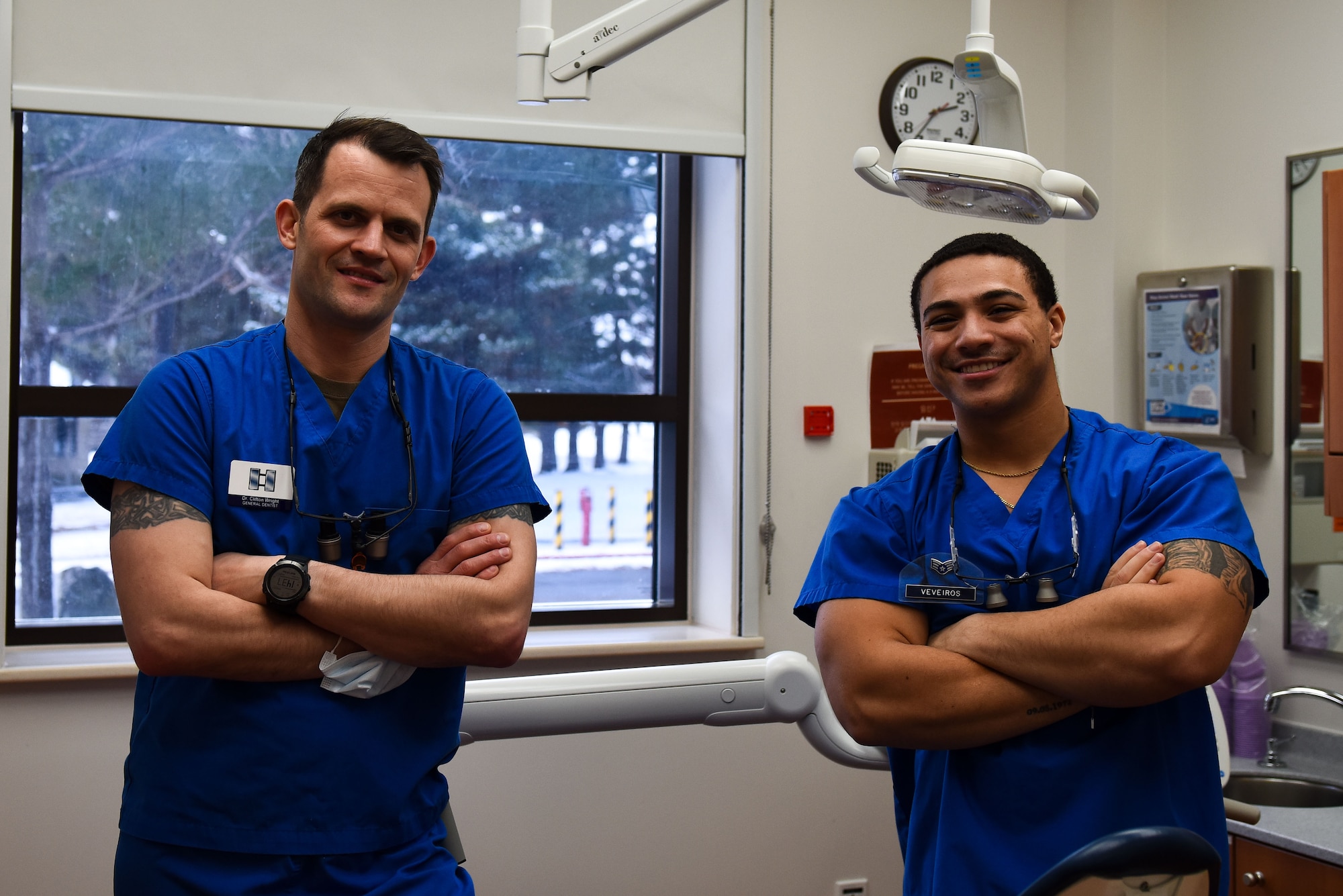 Dr. (Capt.) Clifton Wright (left), 8th Operational Medical Readiness Squadron general dentist, and Senior Airman Malik Veveiros, 8th OMRS dental technician, pose for a photo at Kunsan Air Base, Republic of Korea, Dec. 14, 2022. The Kunsan dental flight can see upwards of 40 patients a day and service over 1,100 individuals throughout the year. (U.S. Air Force Photo by Tech. Sgt. Timothy Dischinat)
