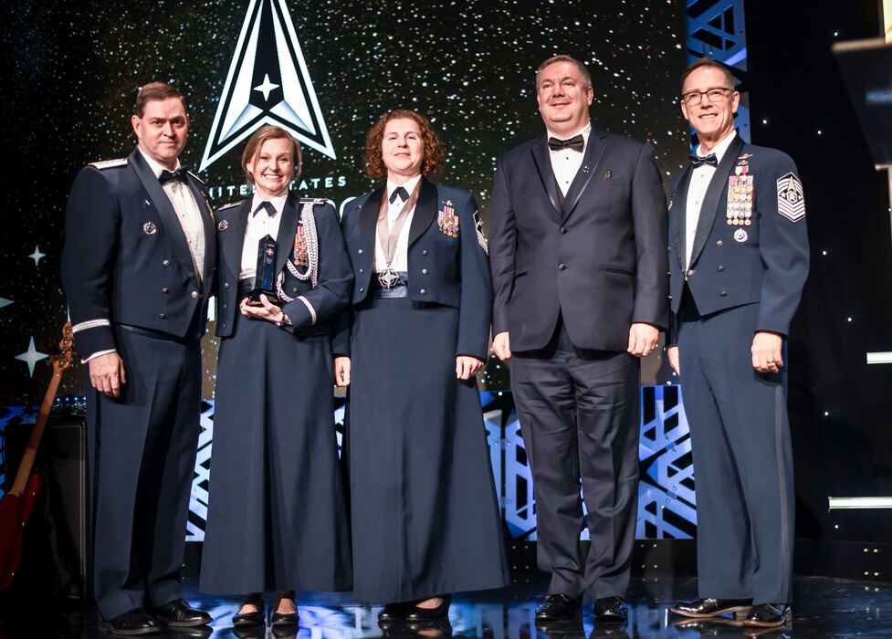 Chief of Space Operations General Chance Saltzman, Captain Justine Pescetello-Parr, Master Sergeant Jennifer McCord, Mr. James Mussmann, and Chief Master Sergeant of the Space Force Roger Towberman pose for a photo after winning the “Team Excellence Award” during the first-ever Polaris Awards.