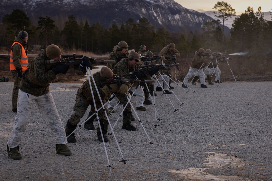 U.S. Marines with 2d Marine Division, execute an arctic range during the NATO Cold Weather Instructor Course (NCWIC) in Innset, Norway, Nov. 29, 2022. NCWIC is a course designed to develop Marines and other service members to be instructors of cold weather survival training in preparation for future deployments. (U.S. Marine Corps photo by Lance Cpl. Averi Rowton)