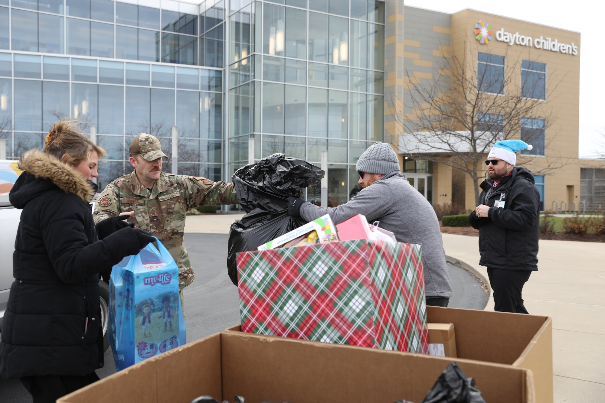 Senior Master Sgt. Brian Anders, 87th Aerial Port Squadron assistant manager, delivers $2,500 of toys and monetary gifts to Dayton Children’s Hospital, Dec. 9, 2022. Airmen with the 87th APS delivered $1,525 in monetary donations and $1,000 in toy donations to the Dayton Children’s Hospital.