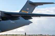 An Airman conducts a final inspection on a C-17 Globemaster III before take-off