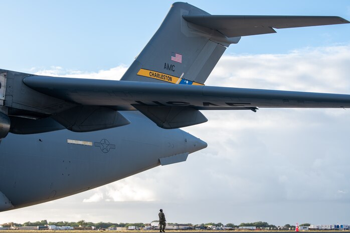 An Airman conducts a final inspection on a C-17 Globemaster III before take-off