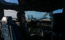 a pilot assigned to the 15th Airlift Squadron, waits for clearance to take-off