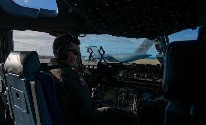 a pilot assigned to the 15th Airlift Squadron, waits for clearance to take-off