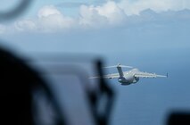 U.S. Airmen in a C-17 Globemaster III simulate an aerial drop over Saipan