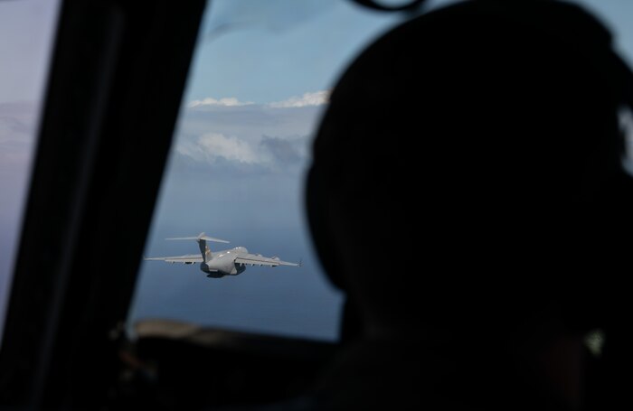 Airmen in a C-17 Globemaster III simulate an aerial drop over Saipan