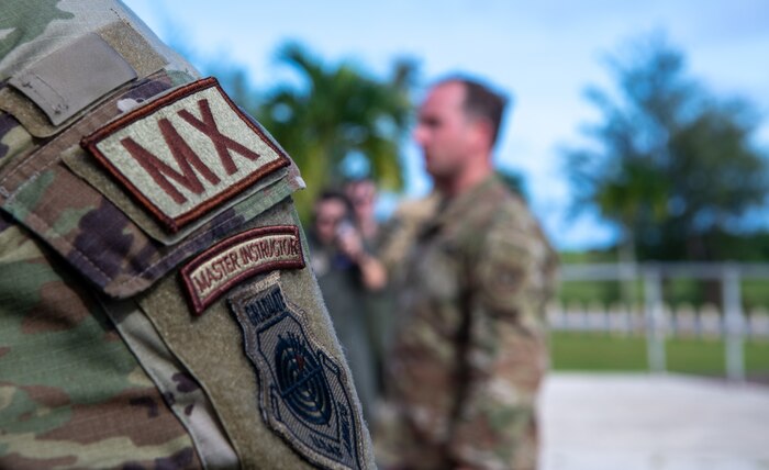 Airmen assigned to the 15th Airlift Squadron rehearse the use of radios