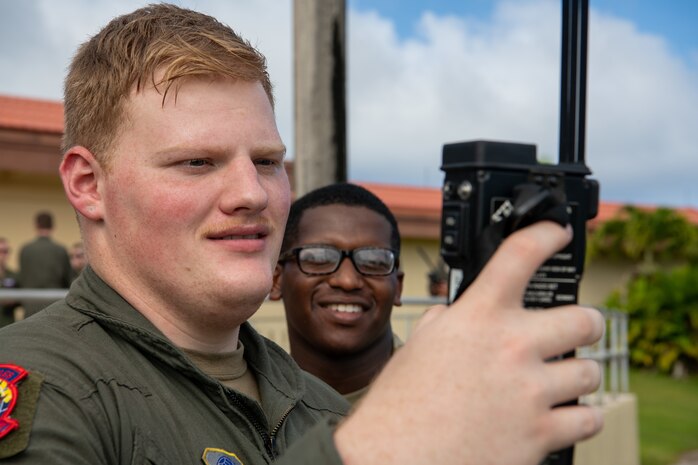 Airmen assigned to the 15th Airlift Squadron test radio capabilities